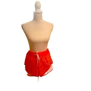 NWOT Maui Rippers lined exercise shorts. Orange palm print size large